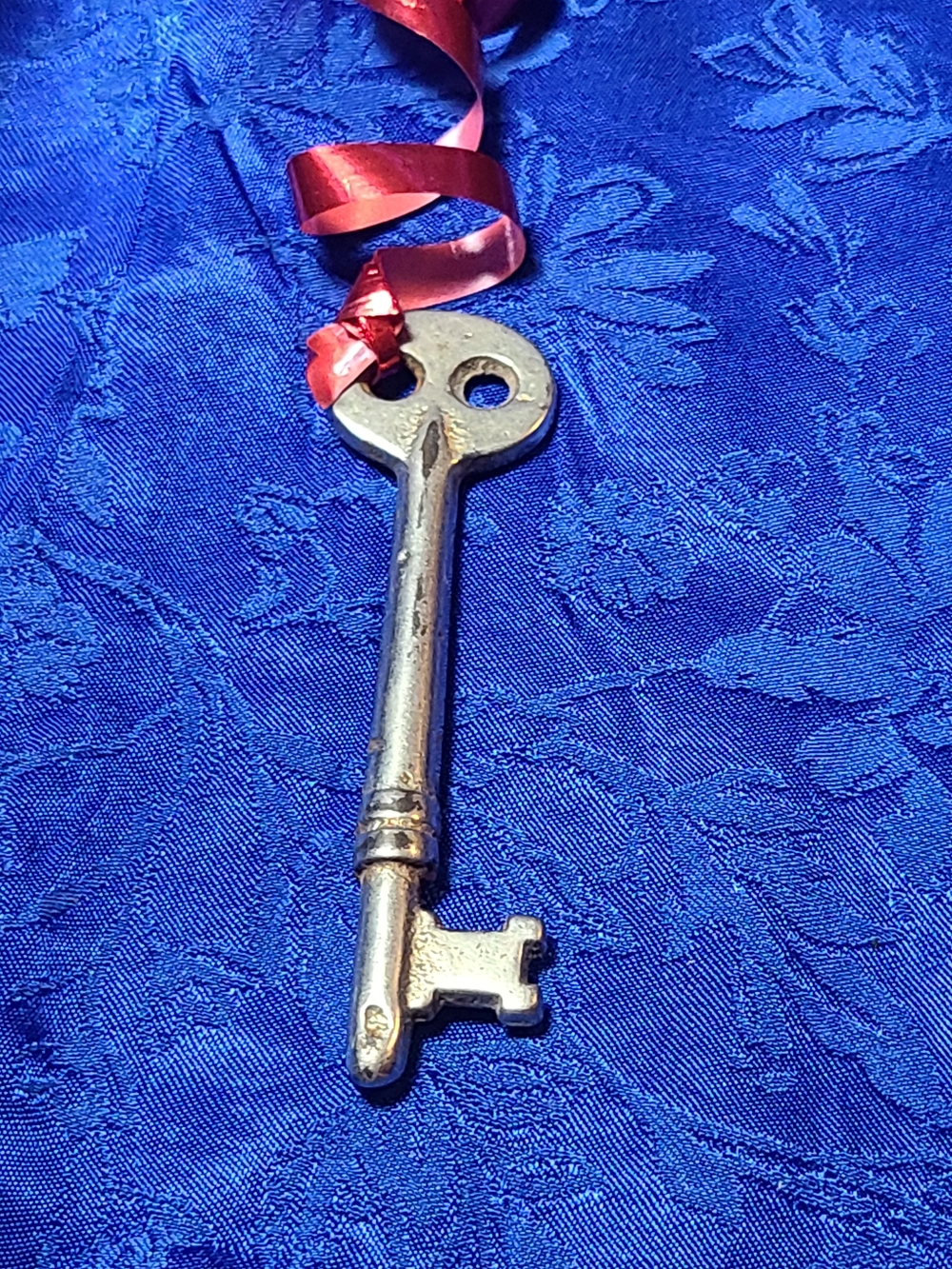 Antique Silver Decorative Skeleton Key with Red Ribbon